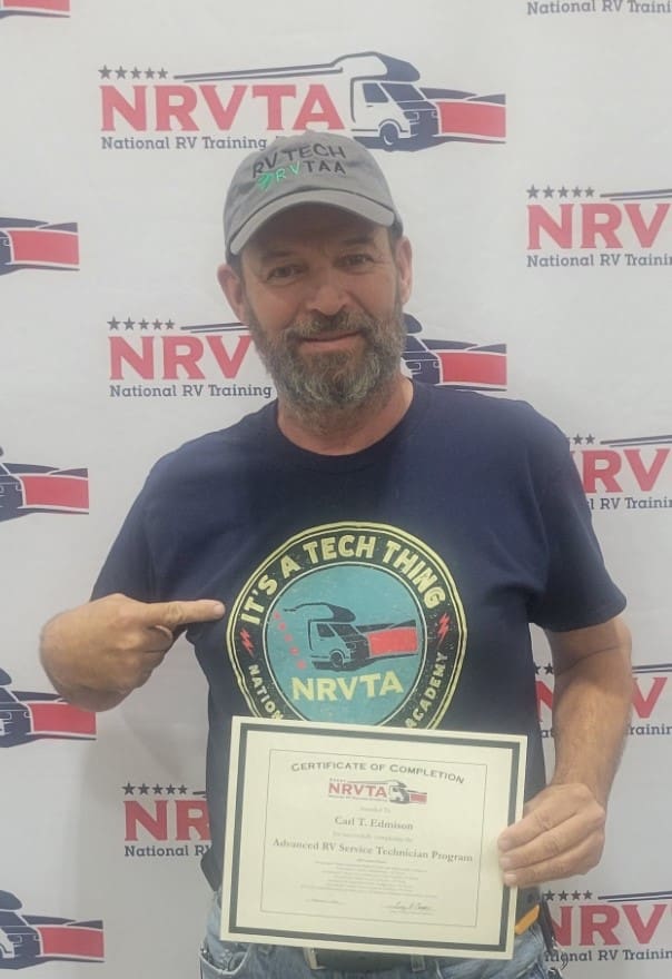 A man holding an award in front of a nrva sign.